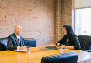 man and woman having a meeting in a conference room