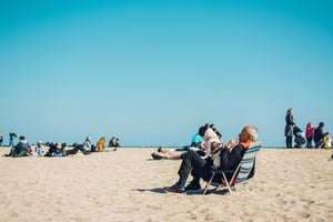 senior on beach in florida with dog